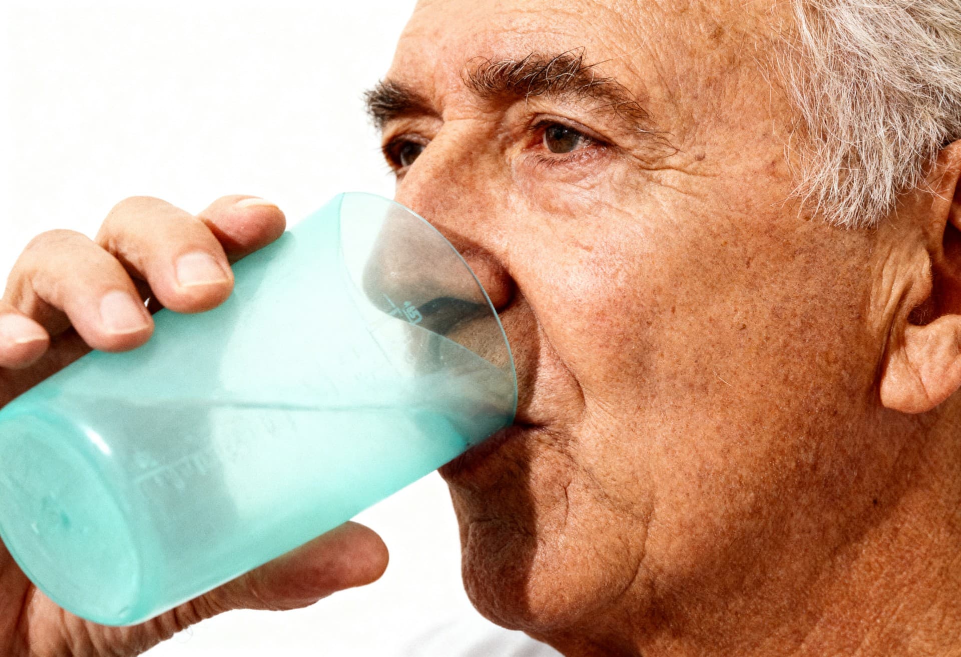 freepik 35mm film photography a senior person drinking wat 28092