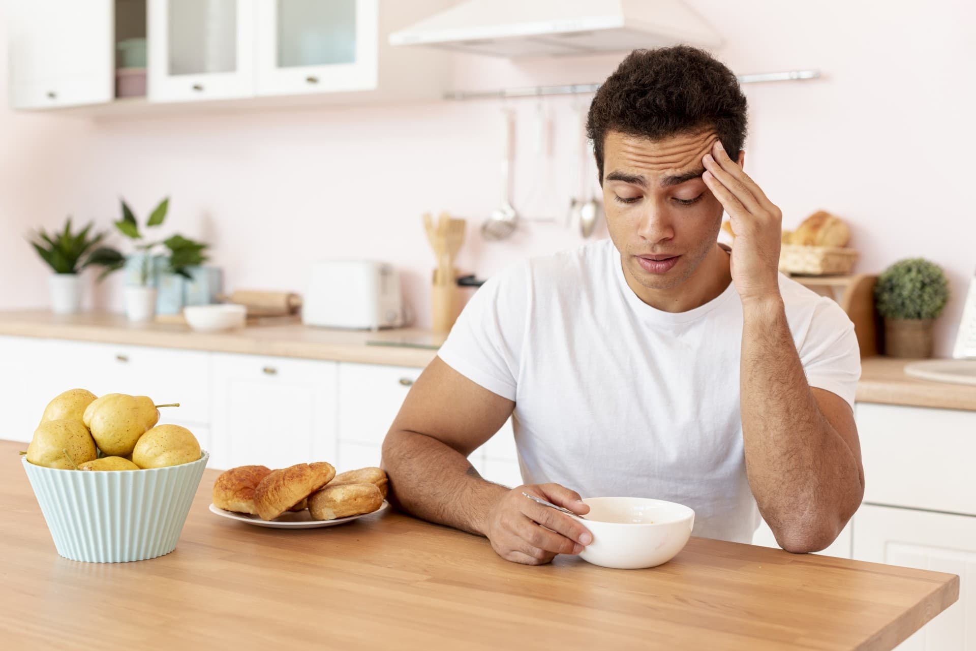 medium shot guy with bowl cereals kitchen